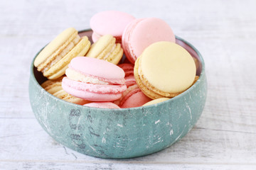 French macaroons in blue bowl.