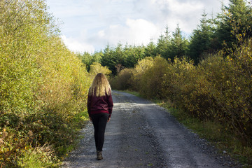 young girl in the mountains with glasses