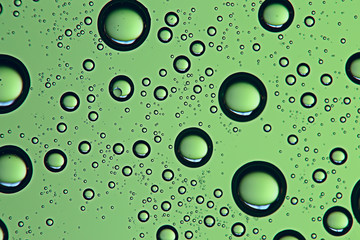 green wet background / raindrops for overlaying on a window, weather, background drops of rain...