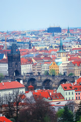 Fototapeta premium Prague view / panoramic landscape of the czech republic, Prague view with red roofs of houses from above, landscape in the European capital