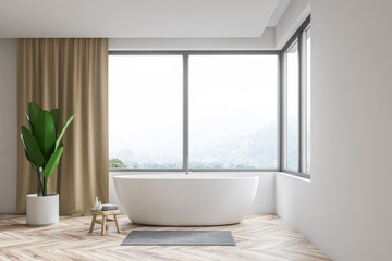 Fototapeta na wymiar White bathroom interior, tub and window