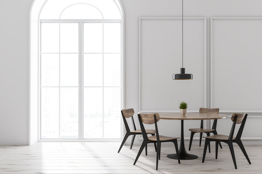 White dining room interior, round table