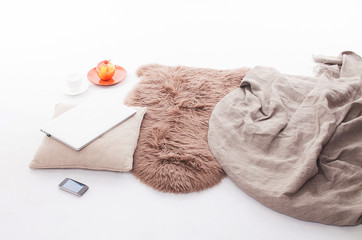 Laptop on floor at home. Woman works at home. Modern laptop and smartphones. 