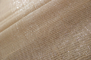 shiny fabric close-up gold canvas for decoration design textiles natural material cotton brocade organza silk material for clothes texture of fabric background