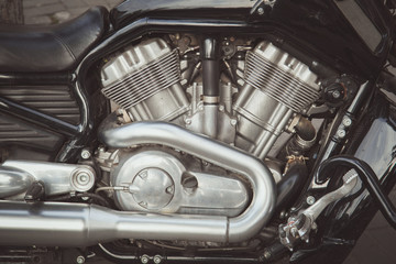 Modern motorcycle engine, close up view, toned
