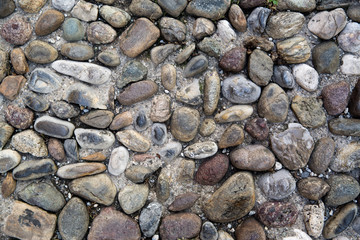 Stone wall background, horizontal wide brick wall.