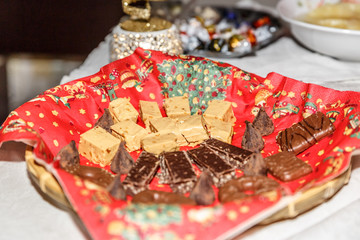 Tray with several types of Spanish Christmas nougat, on a table
