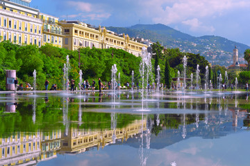 Cityscape with beautiful street fountain. Europe square in Nice.