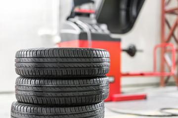 Car maintenance and service center. Vehicle tire repair and replacement equipment. Seasonal tire change - obrazy, fototapety, plakaty