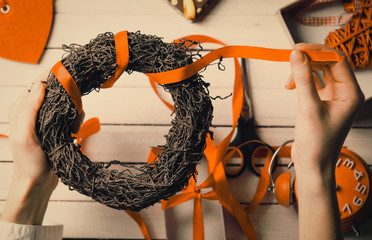 female hands wrapping wreath to present to someone