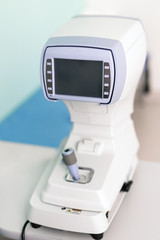 Modern ophthalmology clinic. Keratometer device measuring curvature of cornea. Prevention of astigmatism desease. 	High-tech solutions for eye care