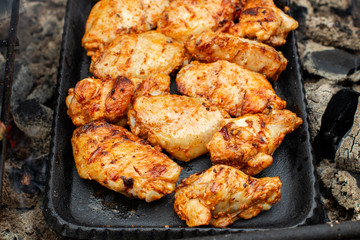 Chicken wings on barbecue grill. Tasty, beautiful and appetizing. Clouse-up.