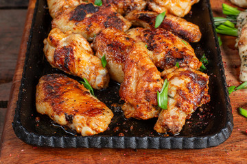 Chicken wings on barbecue grill. Tasty, beautiful and appetizing.