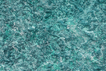 Cyan venetian cement plaster wall background. Close up