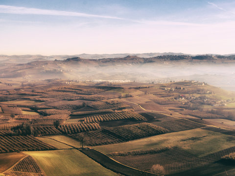 Langhe hills with vineyards in a winter day from Verduno, Barolo area, Piedmont, Italy