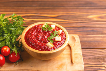Bright fresh tasty pureed tomato soup with ingredients