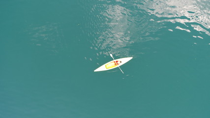 aerial top view of kayaks  over green  lake on sunny summer day - obrazy, fototapety, plakaty