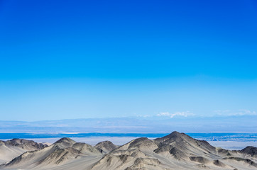 Desert and mountain over blue sky and white clouds on altiplano