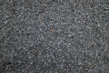 Photo of grey seashore stones, background 