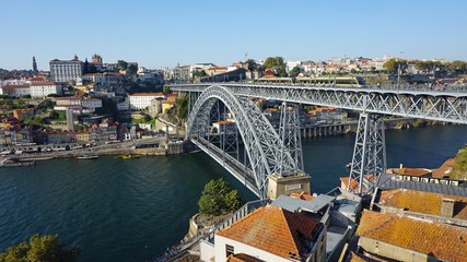 douro river in porto with dom luis bridge and houses