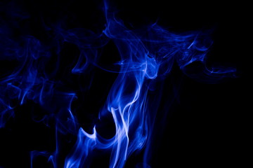 Blue smoke on black background