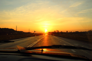 Fototapeta premium Beautiful dawn on the highway. View from the car. Background. Landscape.