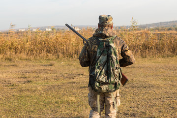 Hunters with a german drathaar and spaniel, pigeon hunting with dogs in reflective vests	