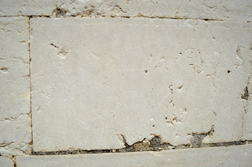 Closeup of natural pattern of stone wall building textured background.