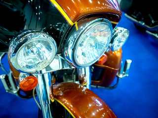 Obraz premium Fragment of a motorcycle. Headlight motorcycle The bike. Men's hobbies.