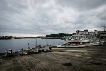 Fototapeta na wymiar boats in harbor (letters mean name of a boat)