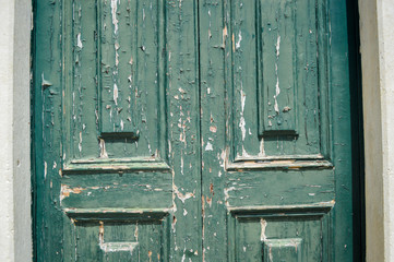 Old woden door textured grungy background, closeup.