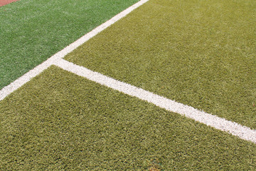Fototapeta premium white line on the green plastic playground
