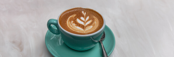 Cappucino latte art coffee cup banner background for cafe. Panoramic header crop of hot espresso coffee drink.