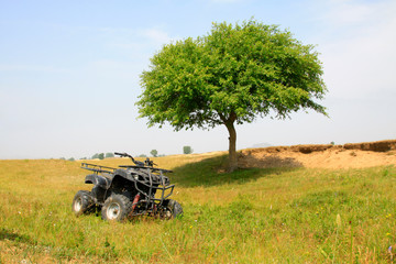 four wheels motorcycle on the grassland