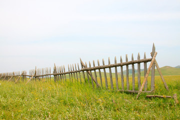 wooden fence in the WuLanBuTong grassland, China