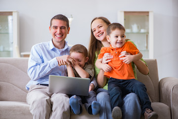 Young family surfing internet and looking at photos