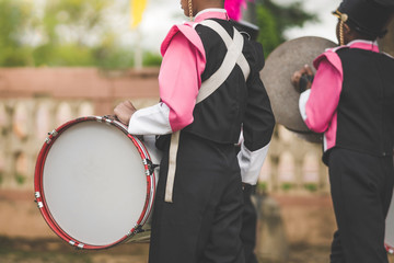 Marching band drummers perform in school parade