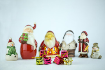 santa claus and snow man with gifts