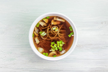 Miso soup with buckwheat soba, champignons, and green onions