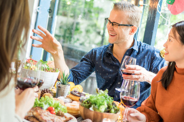 Dinner for Christmas party with family and friend with turkey, salad, steak and red wine.