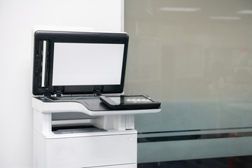 White modern laser multi function printer in the office location