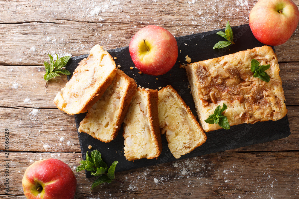 Wall mural freshly baked apple bread with cinnamon and mint close-up. horizontal top view