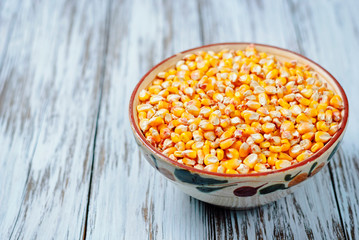 Raw corn grains in a plate