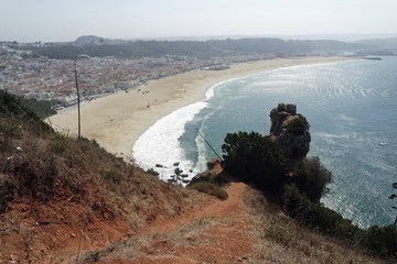 wild shore line at nazare village in portugal