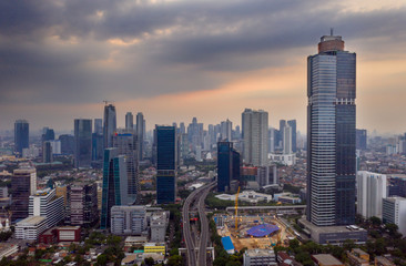 Fototapeta na wymiar High buildings in Jakarta city at dusk time