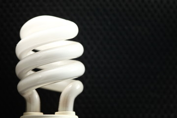Lightbulb on dark background scene.