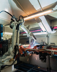 movement of robot welding in factory
