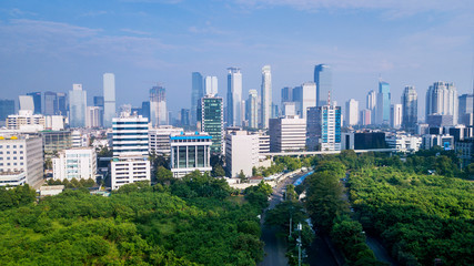 Scenery of trees and skyscrapers in Jakarta
