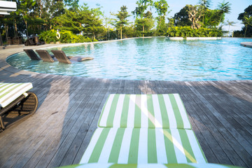Swimming pool with bench chair and wooden floor