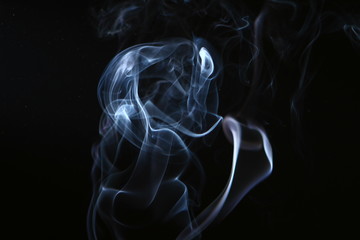 wonderful abstract glowing blue smoke against dark background.